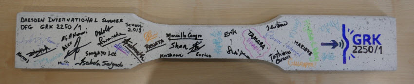 Coupon specimen of SHCC signed by all the participants of the GRK 2250/1 International Summer School