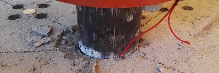 Penetration of a steel projectile in a RC plate on the impacted side after an impact experiment in the drop tower facility.