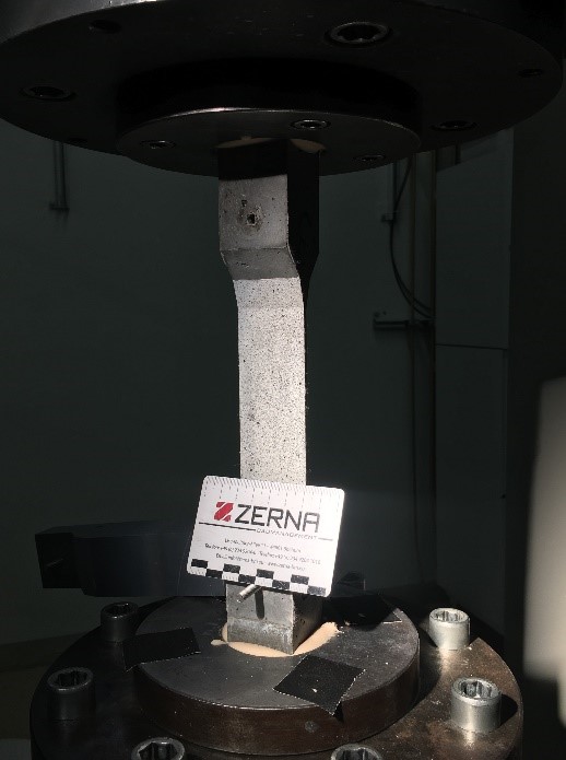 Thin SHCC specimen in a tensile test for calibration of 2D FEM simulations